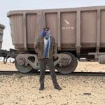 Wiebe Wakker covered in dust after hopping off the Mauritanian iron ore train