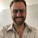 Wiebe Wakker covered in iron ore after riding the Mauritanian iron ore train